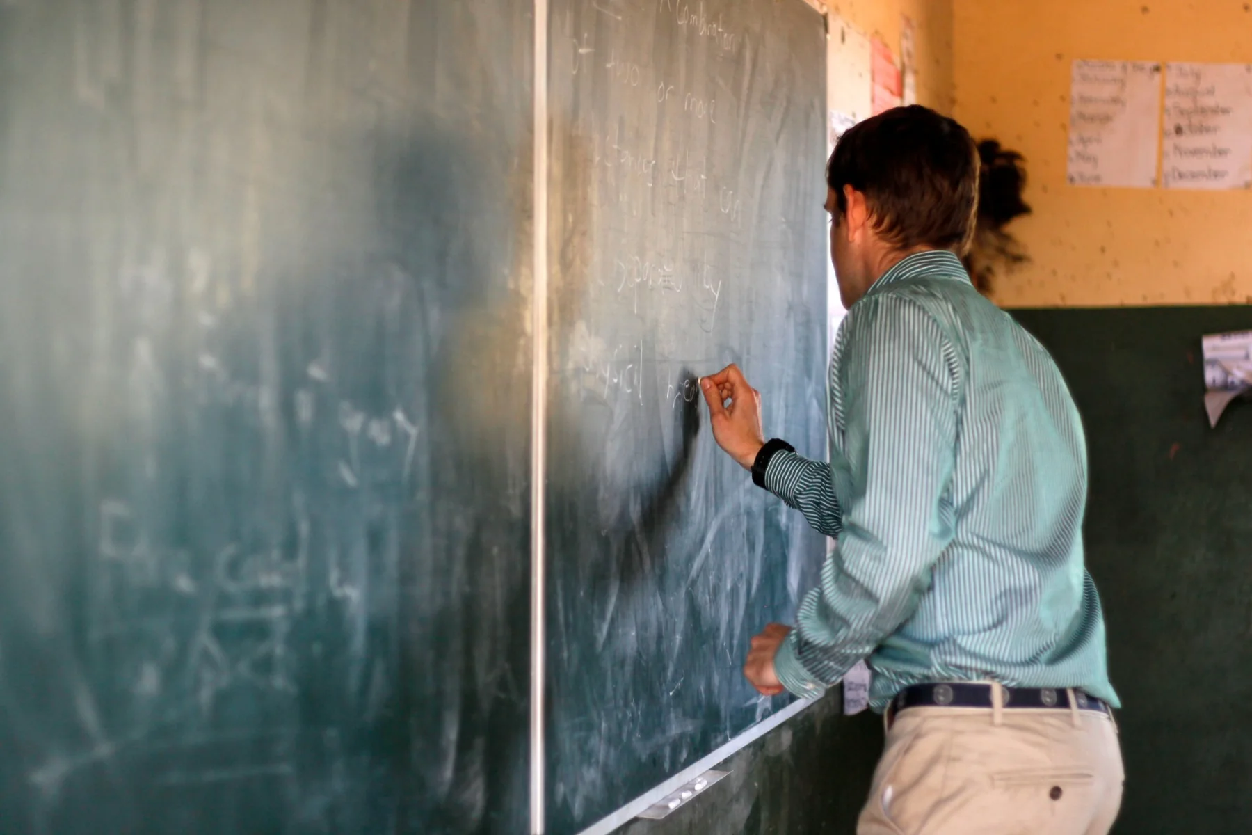 Michael McLaughlin teaching chemistry at a chalkboard